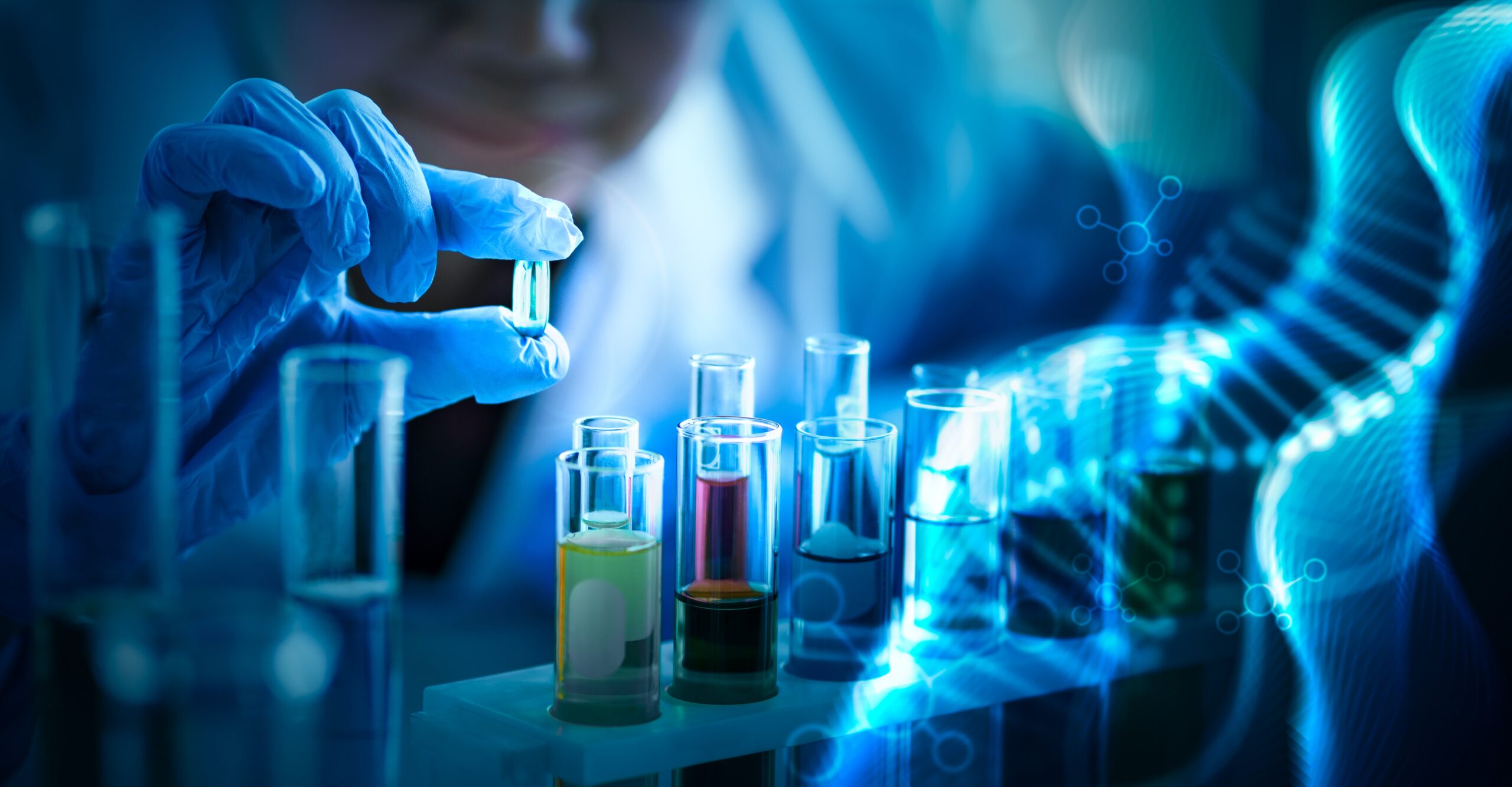 Researcher holding blue pill for health care in laboratory with abstract luminous DNA molecule background. Medical science and biotechnology.