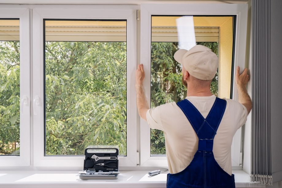 Back,View,Of,Repairman,Adjusting,System,Of,Air,Ventilation,In